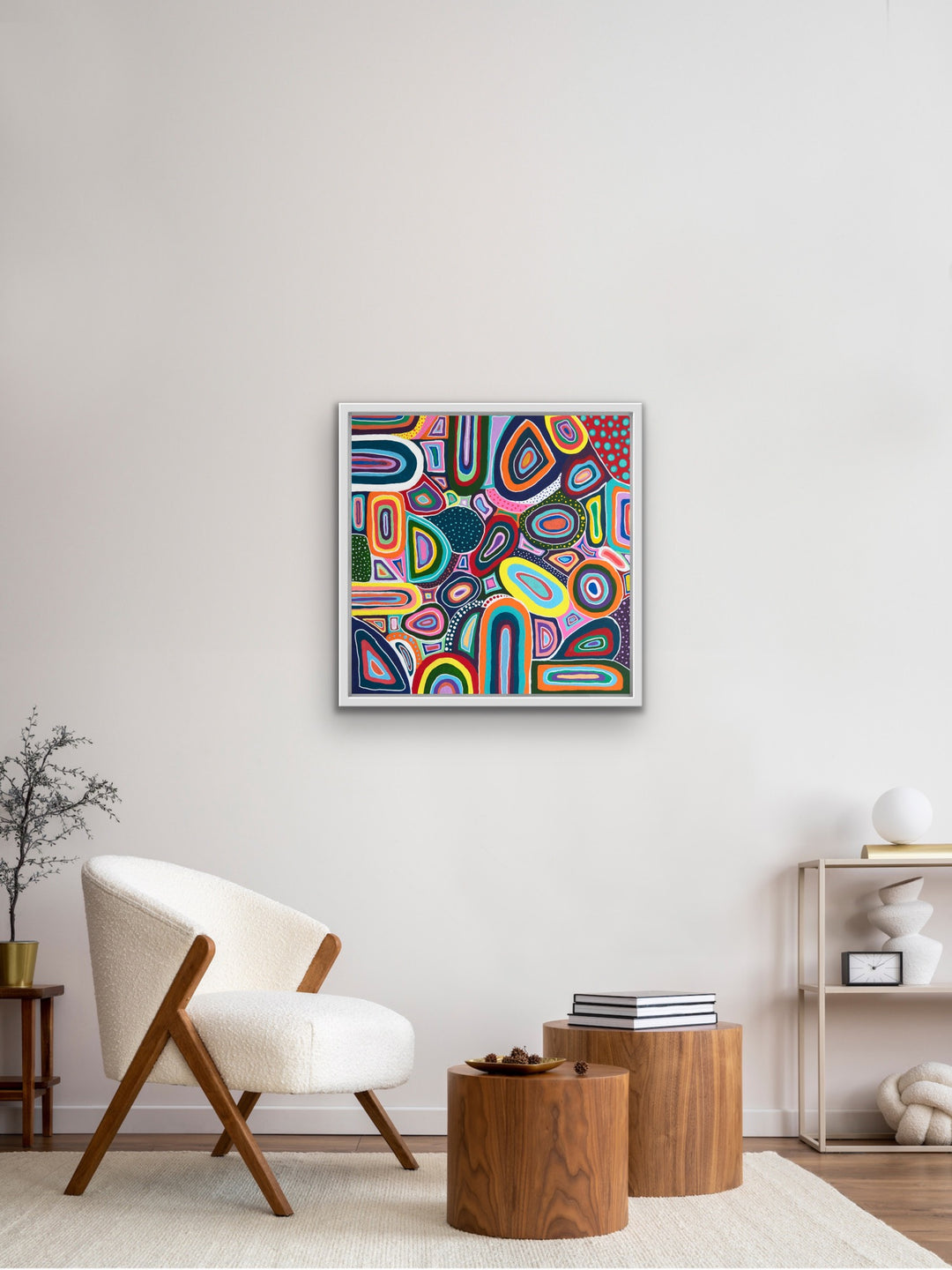 Color Squish original framed abstract folk art painting displayed in modern living room.