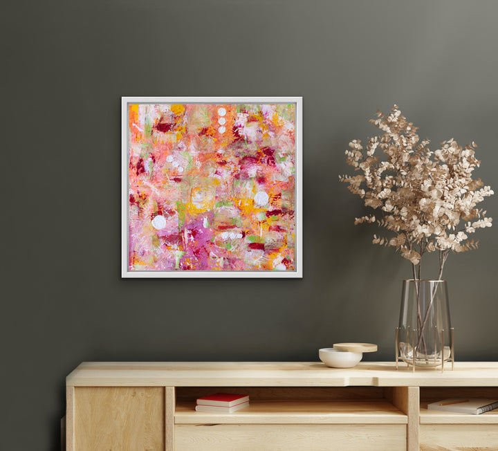 Endless Sunrise original abstract painting in a white frame displayed in a modern home.