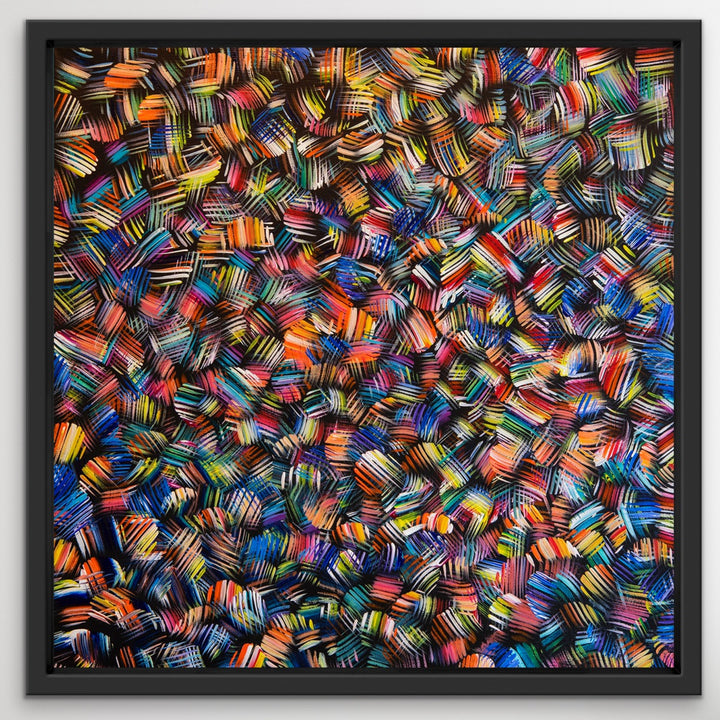 Whirling Rainbows original abstract painting in a black wooden floating frame.