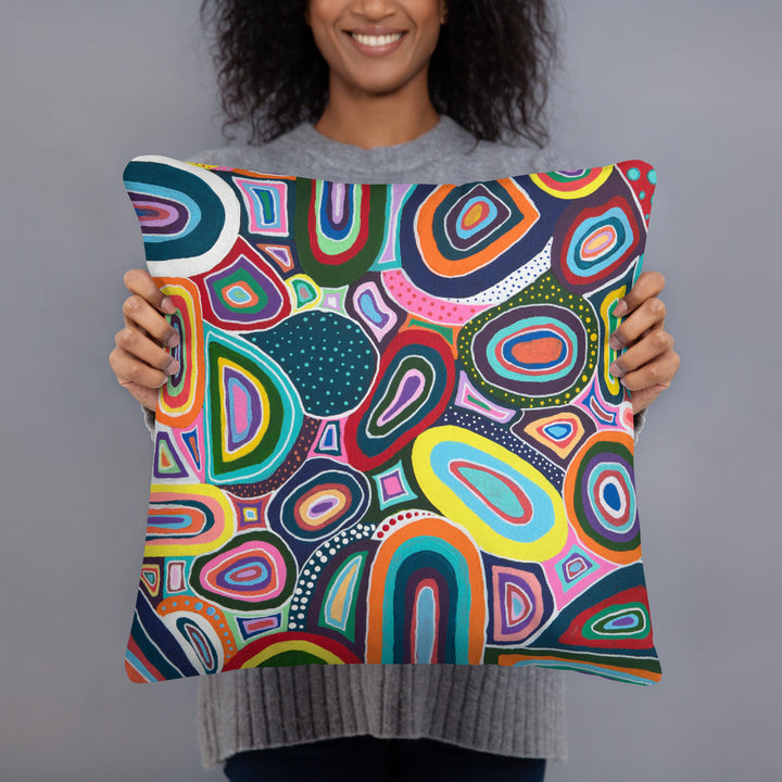 Woman holding folk art pillow in her hands